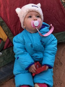 daughter camping in warm clothes