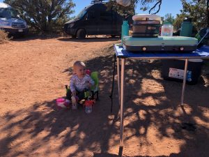 Daughter sitting in infant camping chair