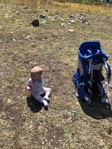 Our Daughter next to our kid carrier backpack