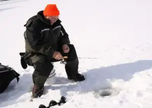 wearing a beanie ice fishing